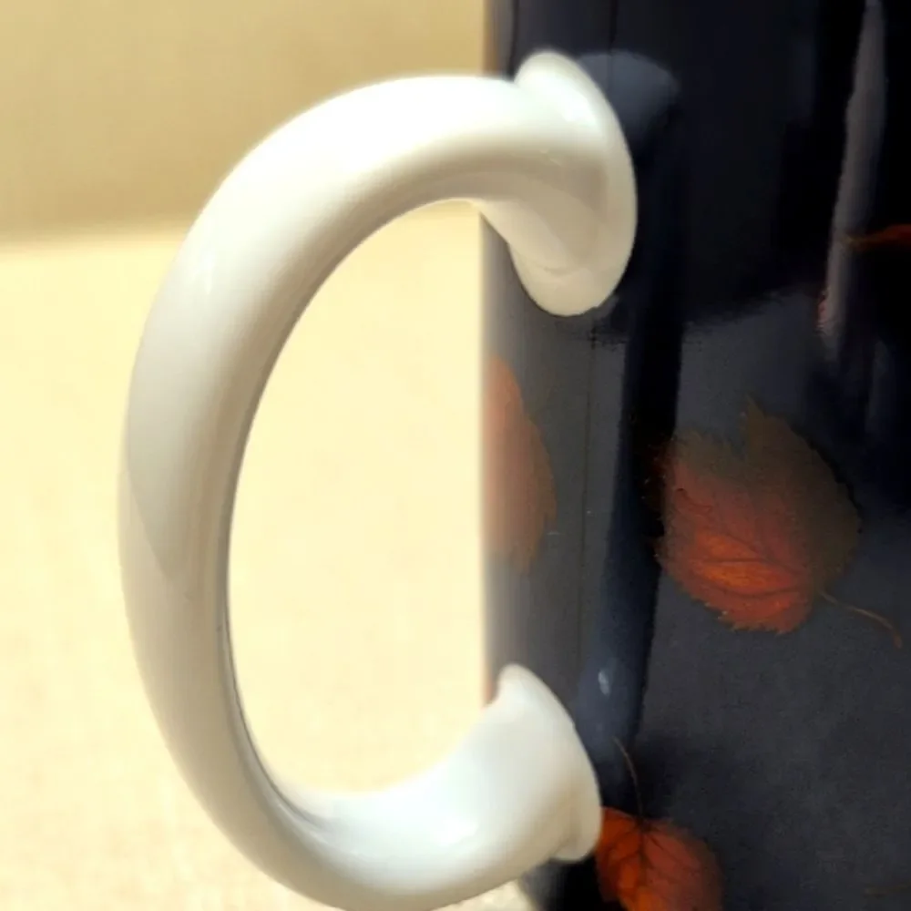 Vintage Catching Leaves Coffee Cat Mug By Lang & Wise Artwork by Lowell Herrero